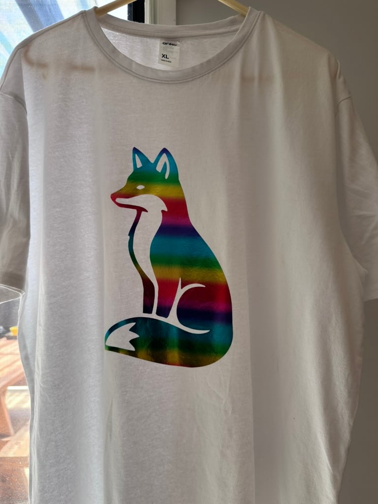 White T-shirt decorated with a rainbow iridescent fox